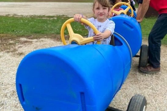 A child enjoys a barrel racer at Tanners Orchard, which offers the Back 40 Fun Acres as well as a Pumpkin Patch for Aurora IL residents