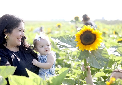 Little girl and mother enjoying sunflower festival at Tanners Orchard, part of Tanners Orchard's many family activities in Illinois